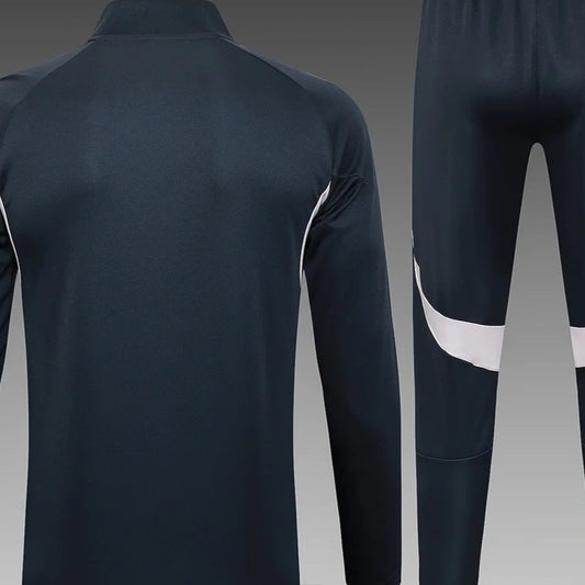 Chaqueta larga con cremallera gris oscuro del Real Madrid 2025/2026